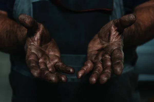 Hands covered in soot